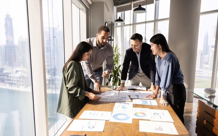 Advisors reviewing documents at a table